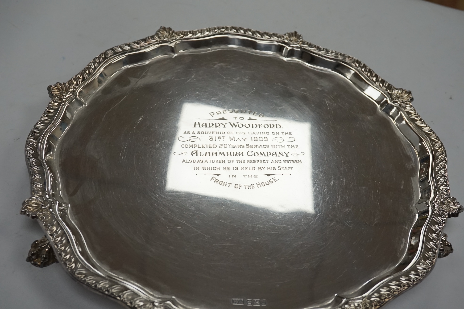 An Edwardian silver salver, with later engraved inscription, on three claw feet, Henry Wigful, Sheffield, 1907, 32.3cm, 27.9oz. Condition - fair to good